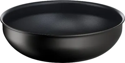 A black wok pan shown from a slightly elevated side angle against a white background.