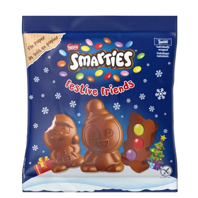 A bag of Smarties Festive Friends chocolate figures with Smarties candies on a blue background with snowflakes.