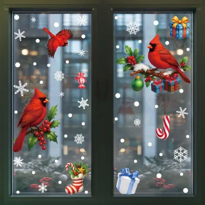 Christmas-themed window stickers featuring cardinals, snowflakes, candy canes, and gifts, applied to a window.