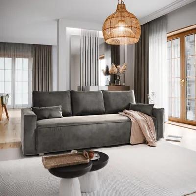 A modern living room with a gray sofa, coffee table, and decorative elements.