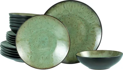 A stack of plates and bowls with a single bowl in the foreground.