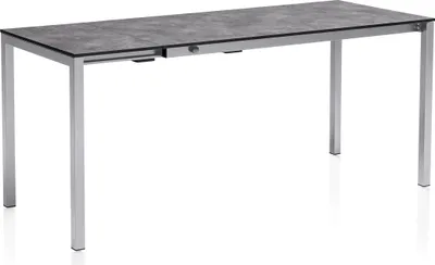 A rectangular outdoor table with a grey speckled top and silver legs, shown against a white background.