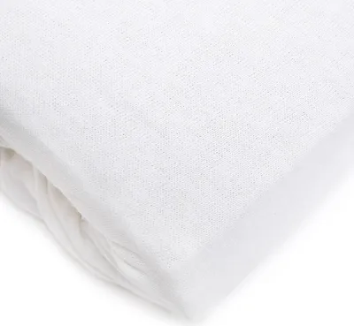 A close-up, folded white jersey bedsheet.