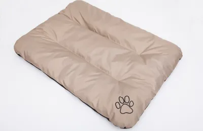 A beige dog mat with a paw print logo on a white background.