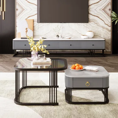 A living room scene featuring two coffee tables in the foreground, a TV stand with a TV above it in the background, and decorative elements.