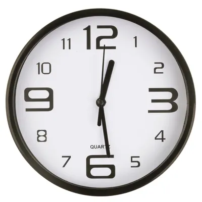 A close-up view of a wall clock against a white background.