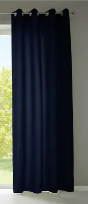 A dark blue curtain hanging in front of a window.