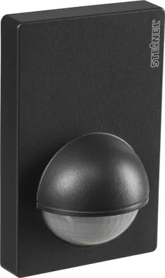 A black motion sensor mounted on a flat surface.