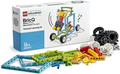 A product box for a LEGO Education BricQ Motion Prime Personal Learning Kit, with some of the kit's components scattered in front of it.
