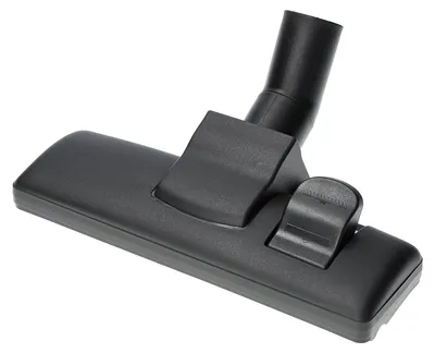 A black vacuum cleaner floor nozzle is shown against a white background.