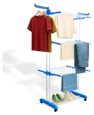 A multi-tiered drying rack with clothes and shoes on it, set against a white background.
