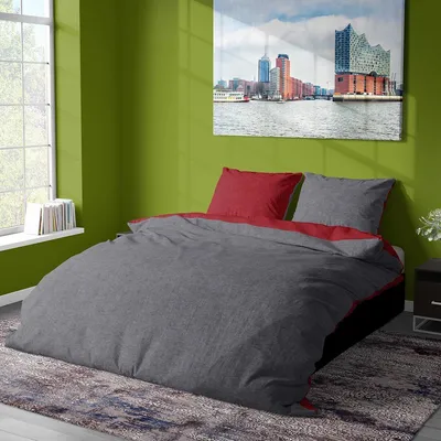 A bedroom scene with a bed, a window, and a painting on the wall.