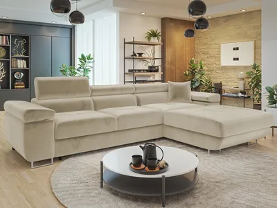 A modern living room with a large sectional sofa and a coffee table.