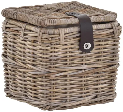 A square woven basket with a lid and a leather strap closure.