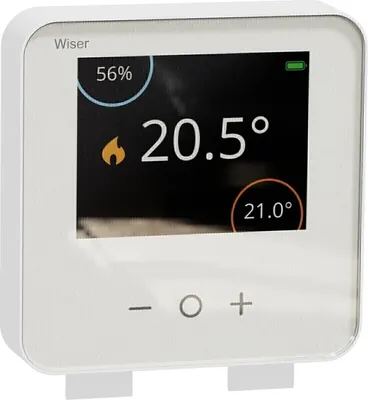A white smart thermostat with a digital display showing temperature and humidity.