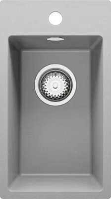 A top-down view of a gray kitchen sink with a drain.