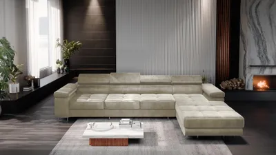 A modern living room with a large sectional sofa, coffee table, and fireplace.