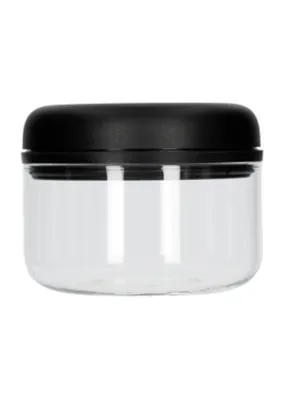 A clear, studio shot of a transparent glass jar with a black lid.
