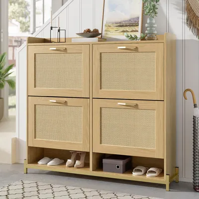 A wooden shoe cabinet with rattan doors and a metal frame, placed in an entryway or hallway.