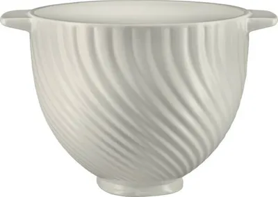 A white ceramic mixing bowl with a swirled texture.