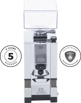 A front view of a coffee grinder with two circular badges on either side.