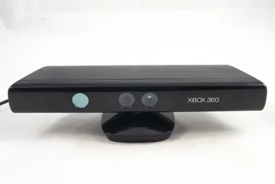 A black Microsoft Xbox 360 Kinect sensor is shown on a white background.