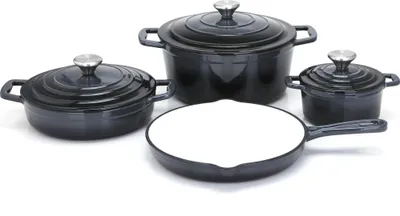 A set of cast iron cookware, including pots and a frying pan, arranged on a white background.