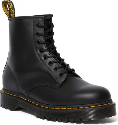 A black leather Dr. Martens boot is shown from a side-angle against a white background.