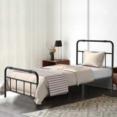 A bedroom scene with a single bed.