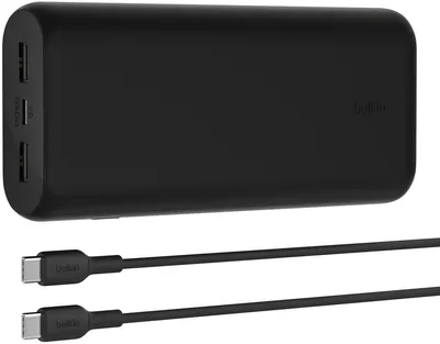 A black Belkin power bank with two USB-C cables.