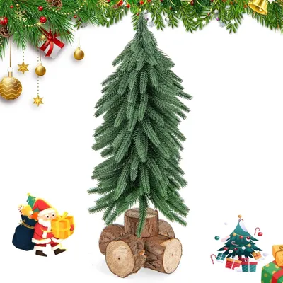 A small artificial Christmas tree with a wooden base, accompanied by a cartoon image of Santa Claus with gifts, and decorative elements like pine branches and ornaments at the top.