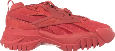 A side profile of a red Reebok sneaker.