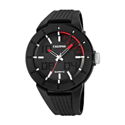 A black Calypso watch with a black strap and a black dial. The watch has white hour markers and red accents on the dial. The brand name 'CALYPSO' is visible on the dial.