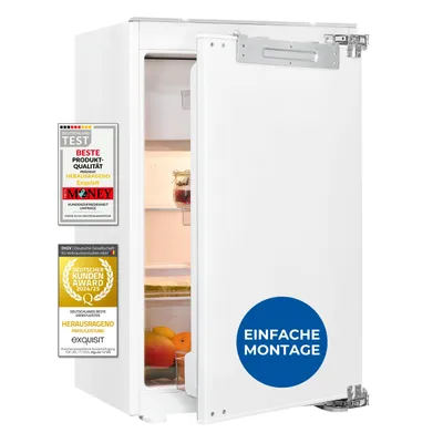 A white built-in refrigerator with its door open, showing internal shelves and some fruit. Several award badges are attached to the left side of the refrigerator door.