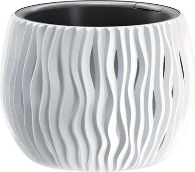 A white planter with a wavy, cut-out design and a black inner pot, shown against a white background.