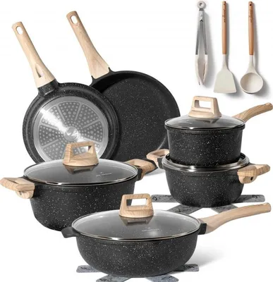 A collection of granite cookware and kitchen utensils arranged on a white background.