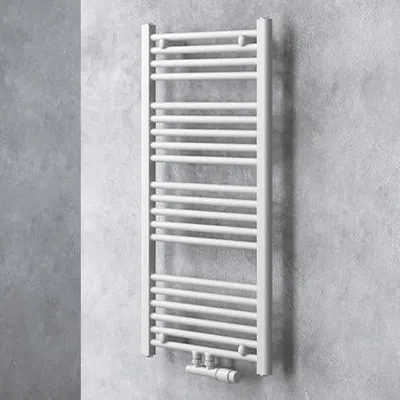 A white radiator is mounted on a textured gray wall.