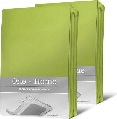 Two green fitted sheets are shown in their packaging, standing upright.