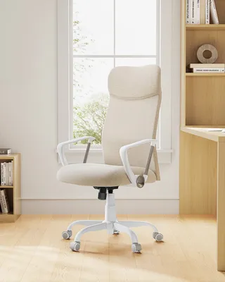 An office chair is shown in front of a large window with natural light. A bookshelf is visible on the right side of the image.
