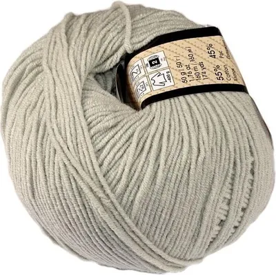 A ball of light gray yarn with a label wrapped around it.