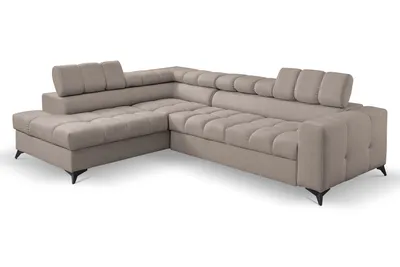 A beige sectional sofa with adjustable headrests and tufted cushions, shown from a side-angle on a white background.