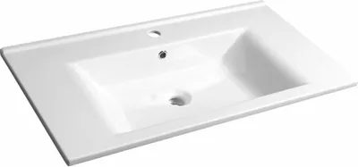 A white ceramic sink with a faucet hole and a drain hole.