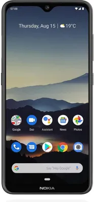 A smartphone with a wallpaper showing mountains and a cloudy sky.