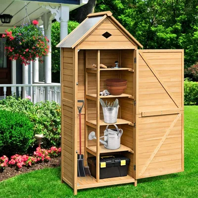 A wooden garden shed filled with gardening tools and supplies, set in a lush garden with flowers and greenery.