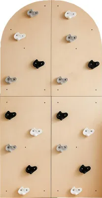 A climbing wall with multiple holds, divided into four sections.