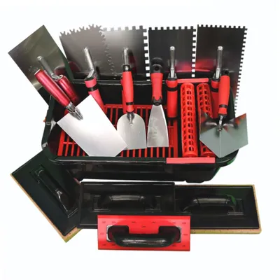A set of tiling tools laid out in a black plastic case.
