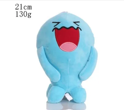 A light blue plush toy with a large open mouth and eyes closed in a wavy line, set against a white background.