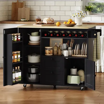 Immagine prodotto di Isola mobile da cucina, dimensioni 104x45(69)x89 cm, con piano di lavoro pieghevole, portasciugamani, cassetto, portabottiglie per vino e ruote bloccabili.