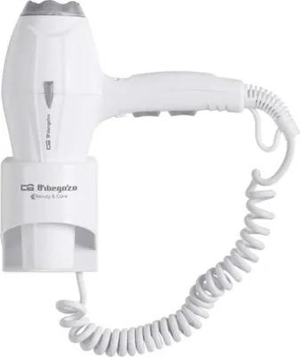 A white professional hair dryer with a coiled cord, mounted on a white base.