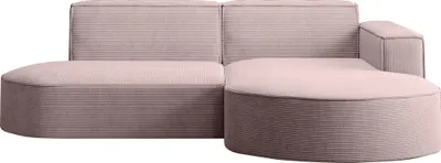 A pink sectional sofa with rounded edges and corduroy fabric.